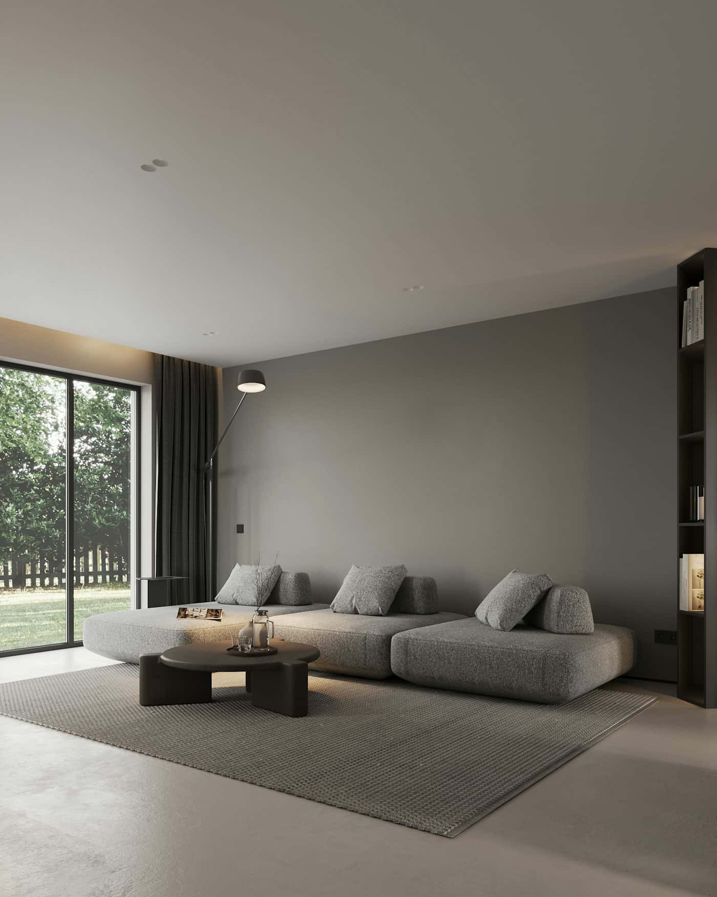 Living luminoso con ventanal de piso a techo y sillón gris